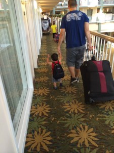 daddy and aj taking the luggage down