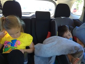 kiddos sleeping and entertaining themselves on a roadtrip