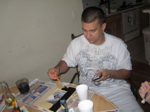 husband painting new picture frame for thismomhere