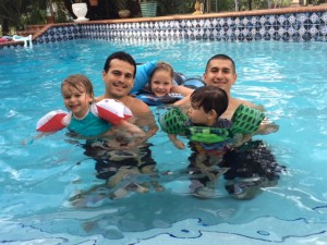 dads in the pool with the kids