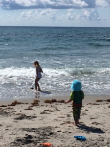 both kids playing at the beach