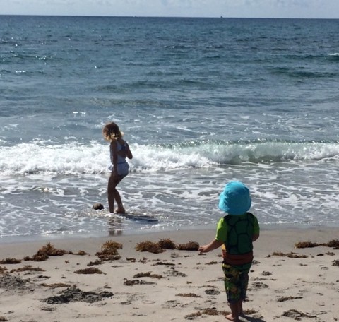 both kids playing at the beach